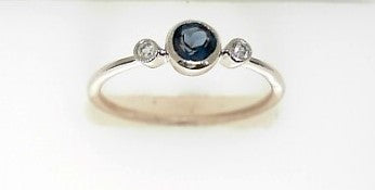 Ladies 14 Karat White Gold Fashion Ring With = .30Tw London Blue Topaz And = 0.04Tw Round H/I Si2 Diamonds Size 7