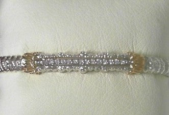 Ladies 14 Karat Yellow Gold And Sterling Silver Closed  Bracelet with SI2 G to H in Color  0.14 Pts. of Diamonds