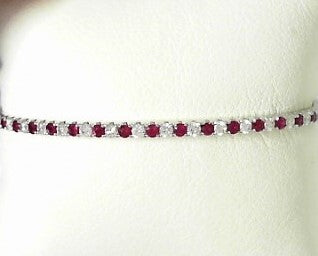 Ladies 14 Karat White Gold Bangle Bracelet With = 0.63Tw Round G/H SI2 Diamonds And = 0.71Tw Round Rubies
