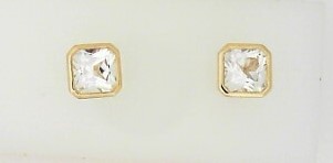 Ladies 14 Karat Yellow Gold Bezel Set Studs With = 2.65Tw Emerald Cut White Topaz