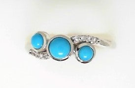 Ladies 14 Karat White Gold  Fashion Ring With = 0.55Tw Round Turquoises And = 0.04Tw Round H/I Si2 Diamonds Size 7