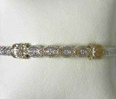 Ladies 14 Karat Yellow Gold And Sterling Silver Closed 3MM Bracelet with SI2 G to H in Color  0.06 Pts. of Diamonds