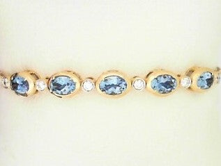 Ladies 14 Karat Yellow Gold Flexible Bangle Bracelet  With = 2.14Tw Oval Aqua Marine And = 0.67Tw Round G/H SI2 Diamonds 6.50