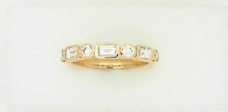 Ladies 14 Karat Yellow Gold Diamond Band With = 0.57Tw Baguette G/H SI2 Diamonds And = 0.33Tw Round G/H SI2 Diamonds = .90 pts.  Size 7.5