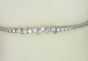 Ladies 14 Karat White Gold Diamond Flexible Bangle  With Pear and Round Shapes = 0.74Tw Round G/H SI2 Diamonds 6.75
