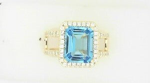 Ladies 14 Karat Yellow Gold Fashion Ring With = 0.47Tw Round G/H SI2 Diamonds And = 4.00 Tw Emerald Cut Blue Topaz Size 7