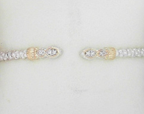 Metal: 14Karat Yellow Gold & Sterling Silver Open End Bracelet 2MM With Diamond Weight: 0.05 pts