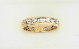 Ladies 14 Karat Yellow Gold Two Tone Diamond Band With = 0.52Tw Baguette G/H SI2 Diamonds And = 0.18Tw Round G/H SI2 Diamonds = .70 pts.  Size 7.5