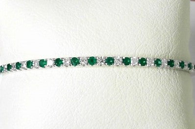 Ladies 14 Karat White Gold Bangle Bracelet With = 0.63Tw Round G/H SI2 Diamonds And = 0.64Tw Round Emeralds