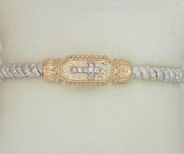 Metal: 14Karat Yellow Gold & Sterling Silver Closed End Bracelet 3MM With Diamond Weight: 0.05 pts