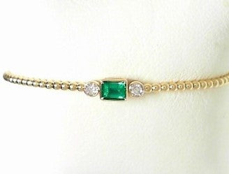 Ladies 14 Karat Yellow Gold Flexible Bangle Bracelet  With = 0.33Tw Emerald Cut Emerald And = 0.14Tw Round G/H Si2 Diamonds 6.75